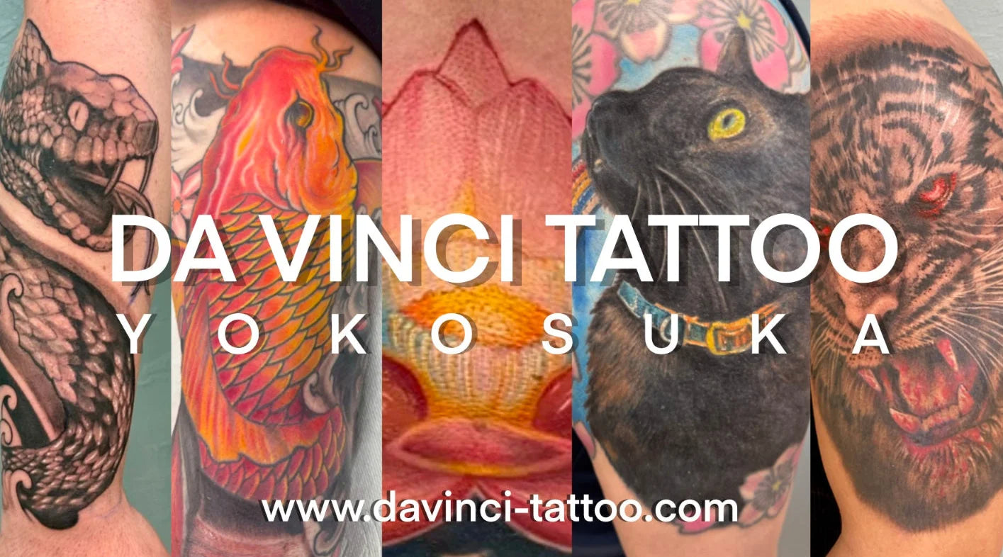 A promotional hero banner collage featuring five tattoo designs, including a custom black snake, red-orange koi fish, colored lotus flower, a black cat, and a semi-colored tiger. Large white text reads 'DA VINCI TATTOO YOKOSUKA' with the website 'www.